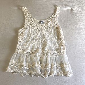 Laze and embroidered tan top.